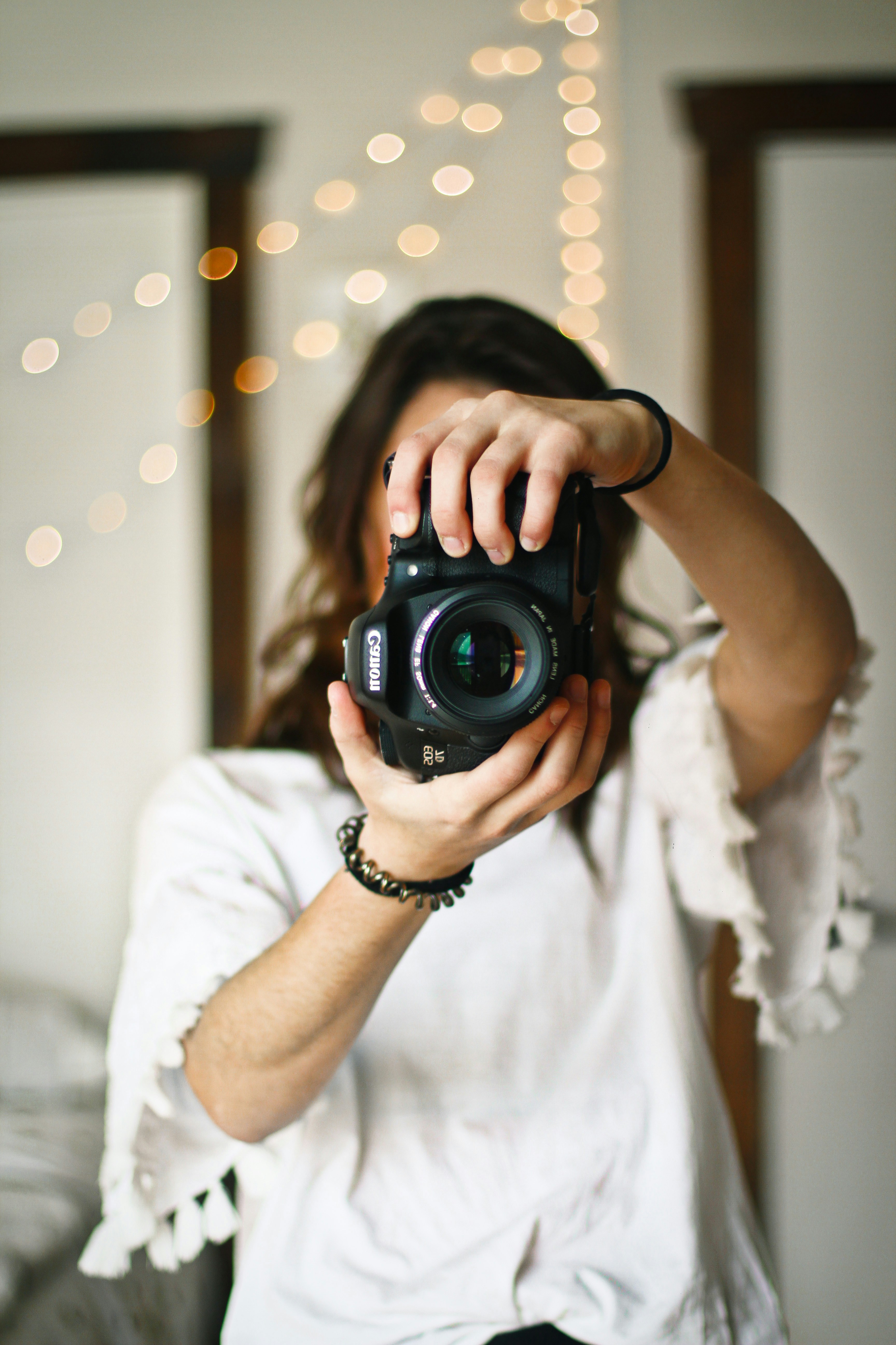 a picture of a random girl holding a camera